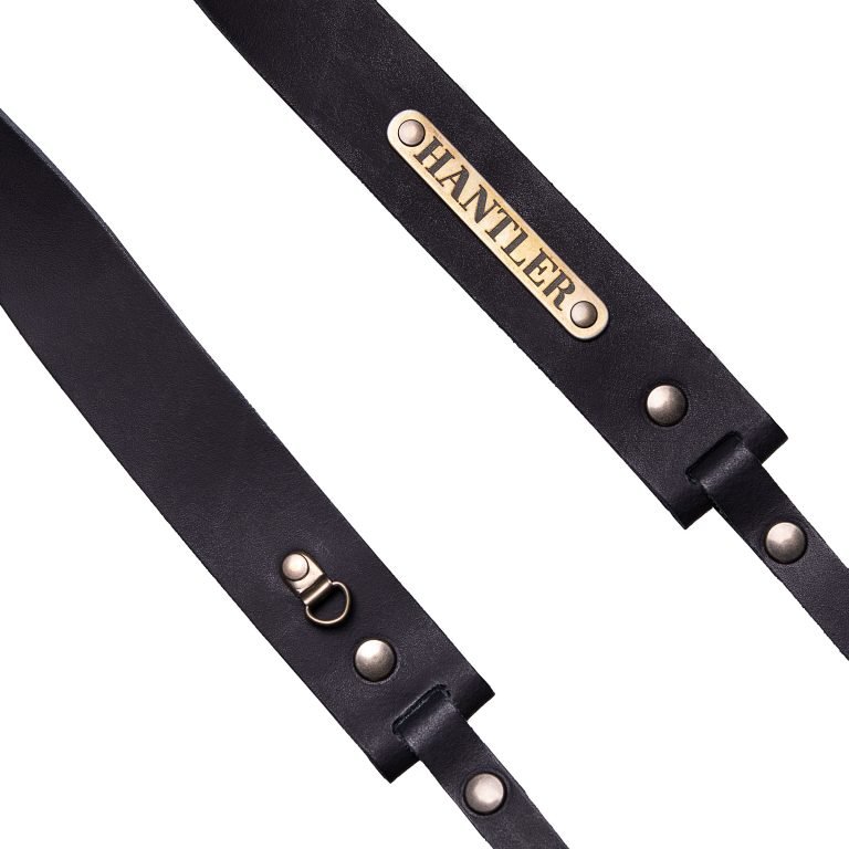 The Hantler's handmade black leather neck strap wich can be personalized with your own name on the metal tag.